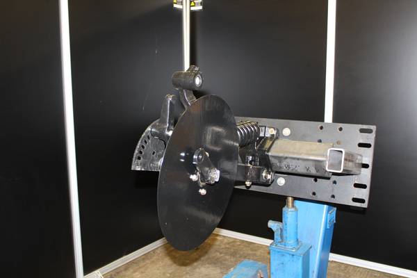 Close-up of remanufactured JD 750 row unit showing Needham seed boot and Niaux disc blade