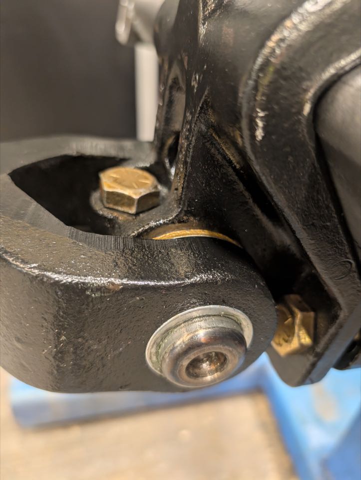 Main opener arm pin on remanufactured row unit